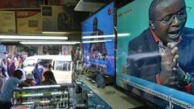 A televised discussion on charges experienced by Kenyan President Uhuru Kenyatta during the Hague-based Global Criminal Court (ICC) becoming fallen, is broadcast on tv sets displayed in an electronics shop, on 5 December 2014, in Kenyan capital Nairobi