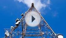 Clouds moving past television broadcast antenna on a